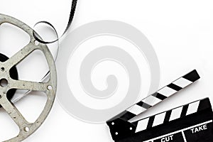 Go to the cinema with film type and clapperboard on white background top view mock up