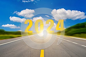 Go to the New Year 2024. Happy New Year greeting card 2024, Happy New Year 2024 letters on the highway road in the destination of