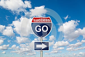 GO to SUCCESS sign on clouds in sky