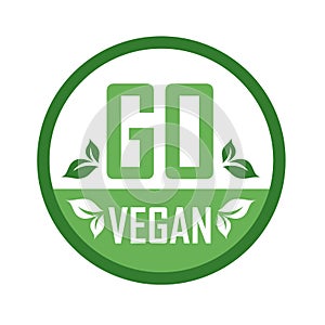 Go Vegan stamp symbol- Vegetarian food safety logo with green leaves photo