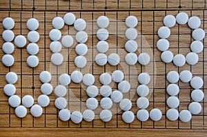 Hallo World Lettering on the famous Asian GO Game in white photo