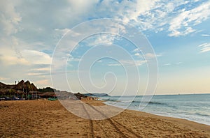 Goa beach and a sand trail with blue sky in India