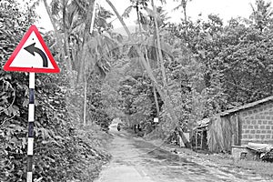 Goa monsoon roads and red traffic sign