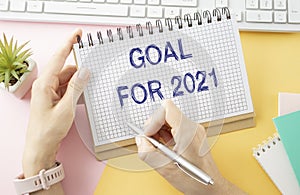 Goal 2021 text on opened notebook
