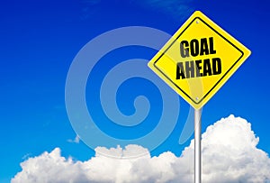 Goal ahead message on road sign