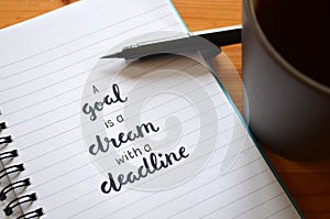 A GOAL IS A DREAM WITH A DEADLINE hand-lettered in notebook