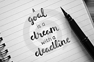 A GOAL IS A DREAM WITH A DEADLINE hand-lettered in notebook