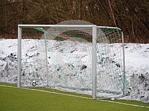 Goal  gate with net and snow at side line