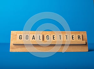 Goal getter words on a wooden ledge photo