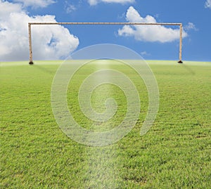 Goal o football on green grass blue sky