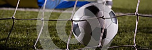 Goal. Panorama. Soccer football ball scores a goal on the net