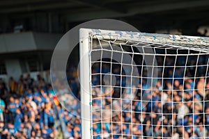 Goal post with soccer fans