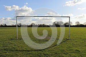 Goal Posts On A Field In The Sun