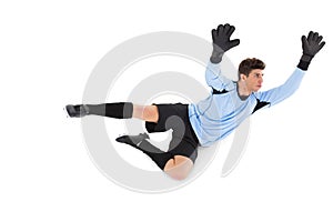 Goalkeeper in blue making a save
