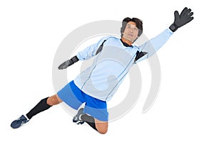 Goalkeeper in blue making a save