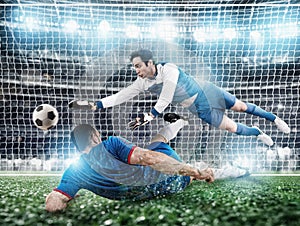 Goalkeeper catches the ball in the stadium during a football game.