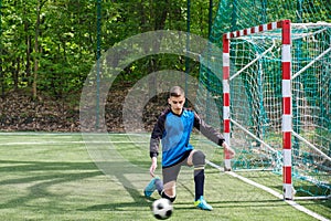 Goalkeeper catches the ball. Stadium goalie sports play ground game, grass soccer keeper man, outdoorsc ompetition,