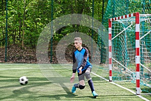 Goalkeeper catches the ball. Stadium goalie sports play ground game, grass soccer keeper man, outdoorsc ompetition