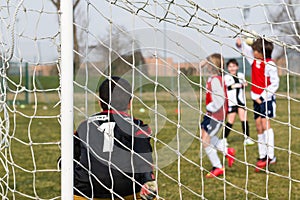 Goalkeeper, defenders on wall and little soccer player for a pen