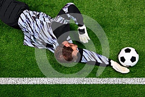 Goalkeeper diving to save the ball