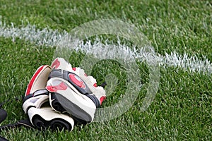 Goalkeeper gloves in the grass