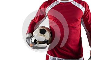 Goalkeeper holds the ball in the stadium during a football game. Isolated on white background