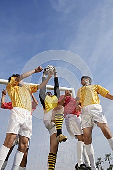 Goalkeeper Jumping To Save Goal Against Sky