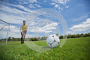 Goalkeeper ready to kick the soccer ball