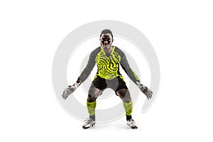 Goalkeeper ready to save on white background