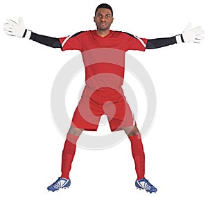 Goalkeeper in red ready to save