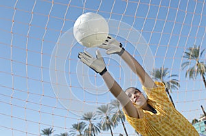 Goalkeeper Stretching To Block Goal Attempt