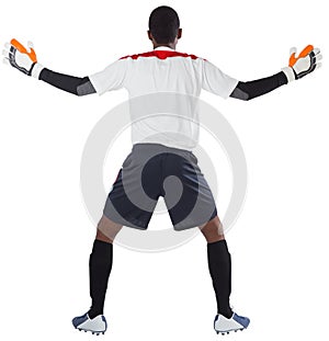 Goalkeeper in white ready to save