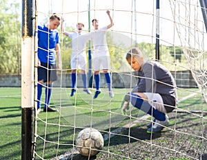 Goalkipper feeling sad about he didn't catch ball