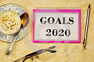 Goals 2020-writing text on a Notepad. Long-term vision of future actions, development of a method for achieving a stable long-term