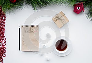 Goals for new year in blank open notebook top view