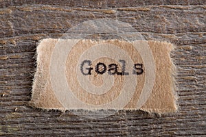 Goals word on a piece of paper close up, business creative motivation concept