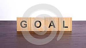 goals written in wooden cubes. conceptual word collected of of wooden elements with the letters. stock image, brown