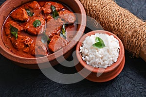 Goan spicy red fish curry and rice, Indian fish curry photo