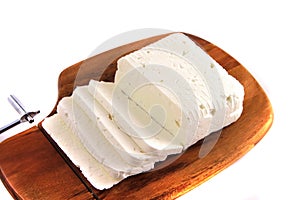 Goat cheese on cutting board