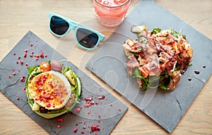 Goat cheese and ham salads on cafe table