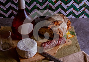 Goat cheese with wine bread and salami