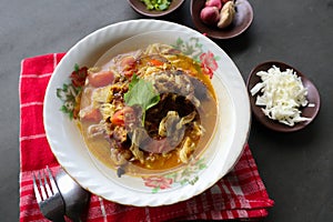 Goat Curry or gulai kambing, food from asia. Delicious goat meat curry served in a bowl.. photo