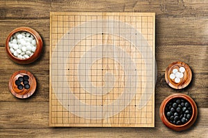 Goban, Baduk, Weiqi or Maklom - Traditional asian strategy board game. black and white stones boardgame - top view