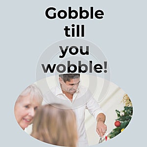 Gobble till you wobble text with happy caucasian family serving at christmas dinner table