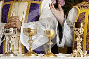 Goblet and ambula at the altar, prayer and blessing during mass