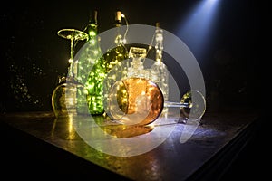 Goblet of white wine on wooden table on wooden wall background