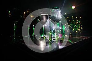 Goblet of white wine on wooden table on wooden wall background