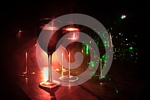 Goblet of white wine on wooden table on wooden wall background