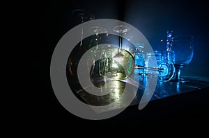 Goblet of white wine on wooden table on wooden wall background