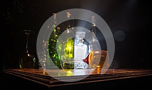 Goblet of white wine on wooden table on wooden wall background